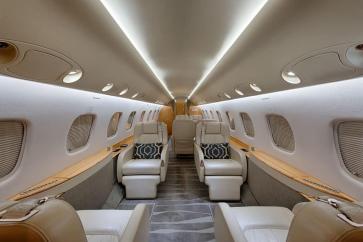 Three-zone cabin of the Embreaer Legacy 600 private jet.