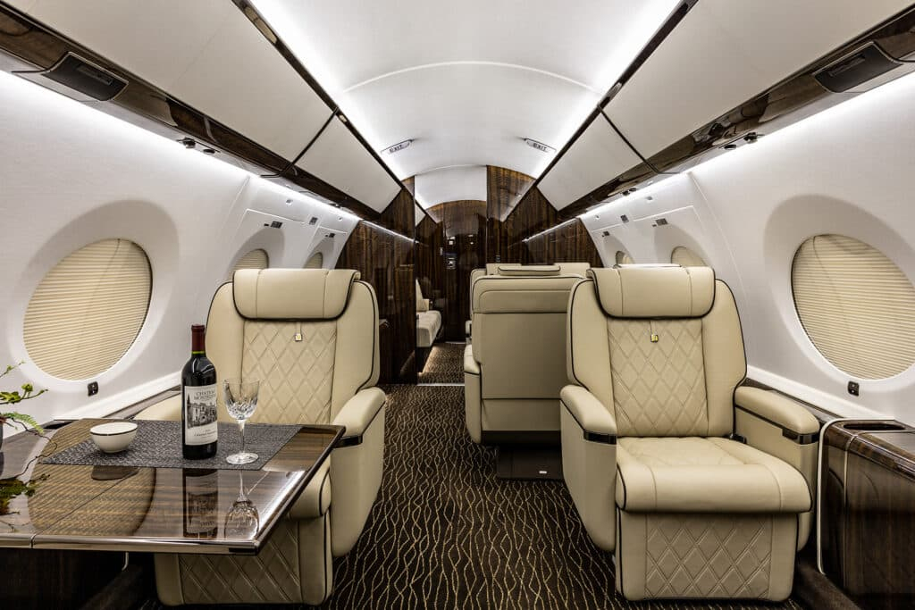 Gulfstream large cabin private jet interior.